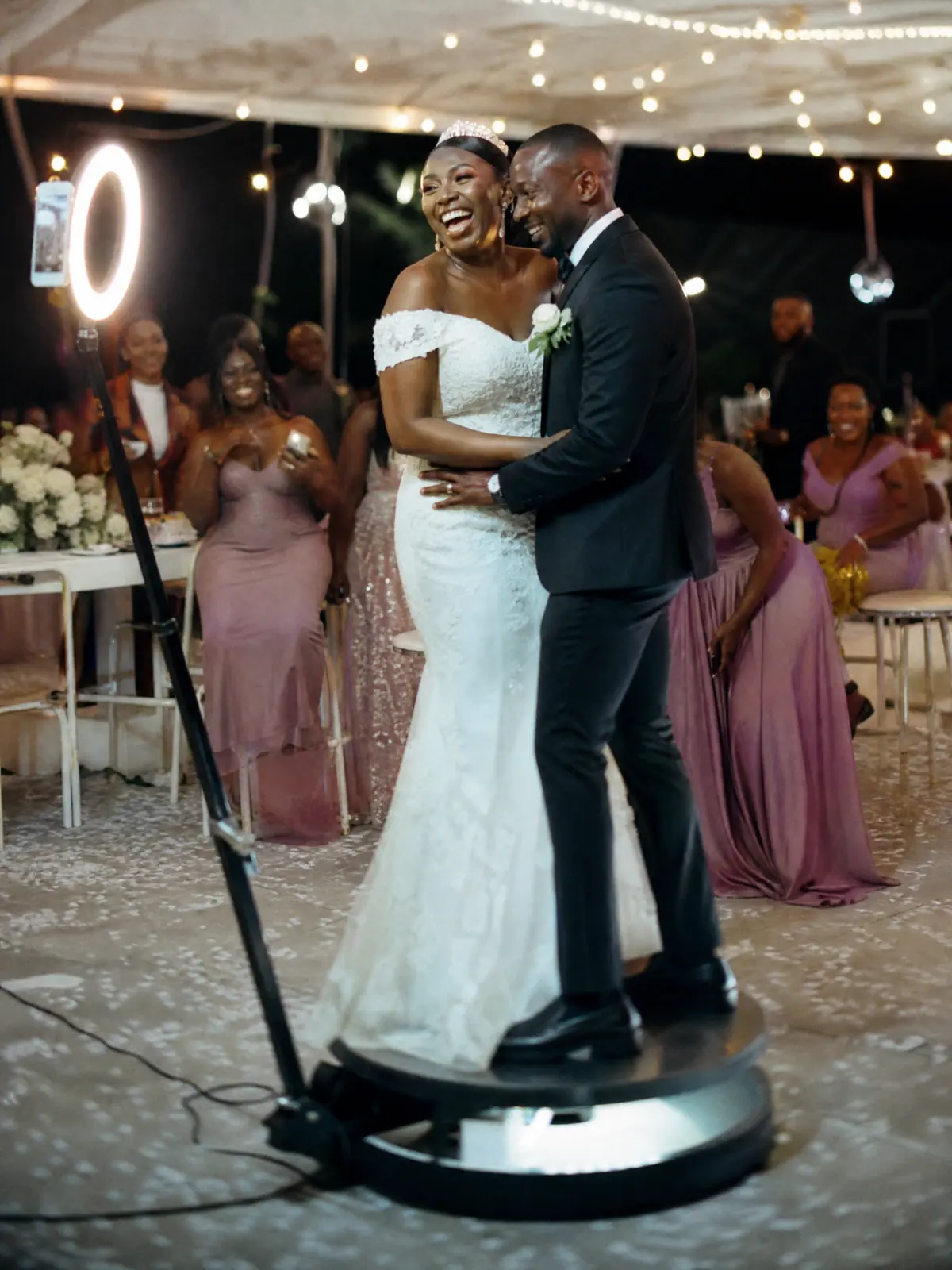 Newly married couple on the 360 booth under warm gold lights at an Aberdeen hotel reception