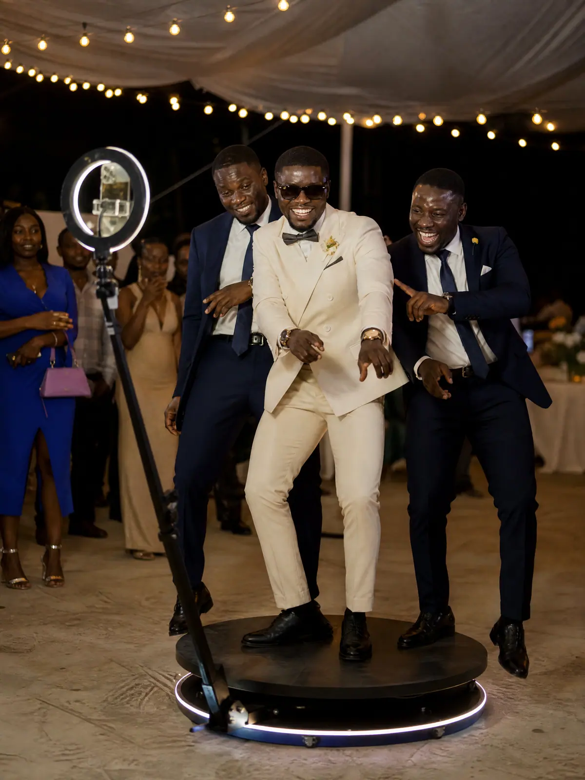 Groom and groomsmen dancing as the 360 camera arm circles them